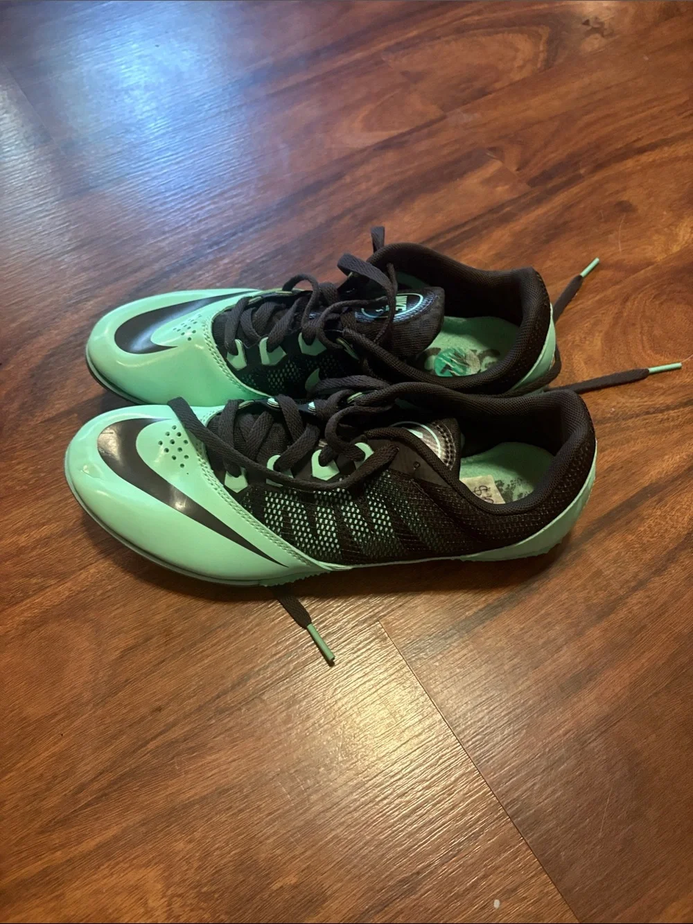 Nike Mint Green and Black track shoes